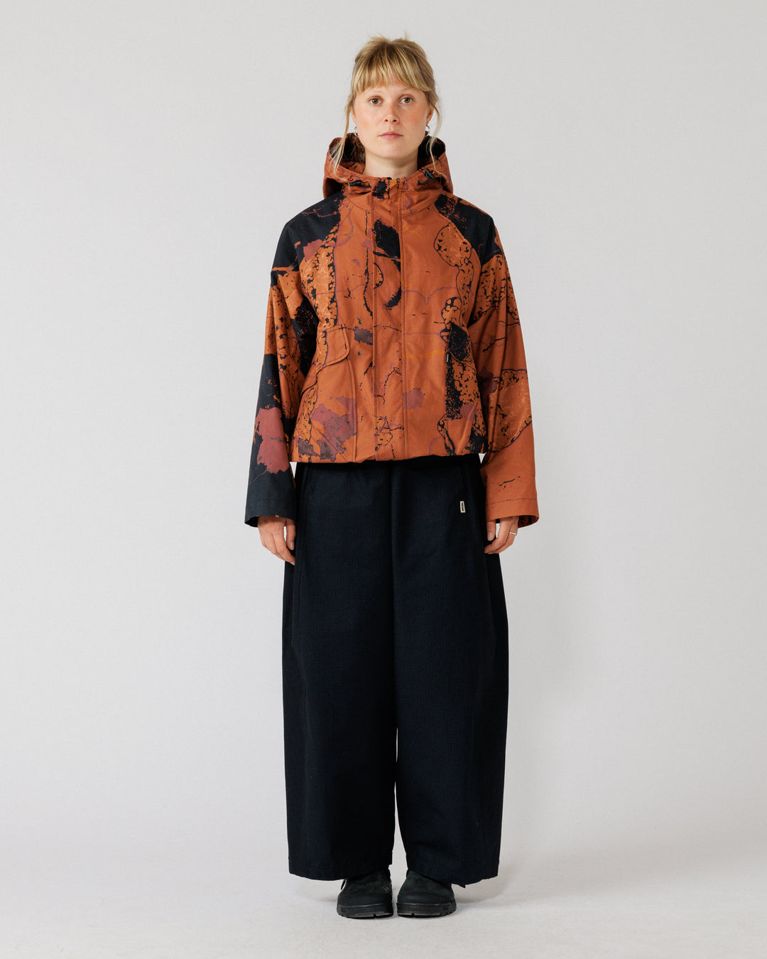 Roam Raglan Jacket - Abstract Brick Camo — hero: full front, zipped, clean