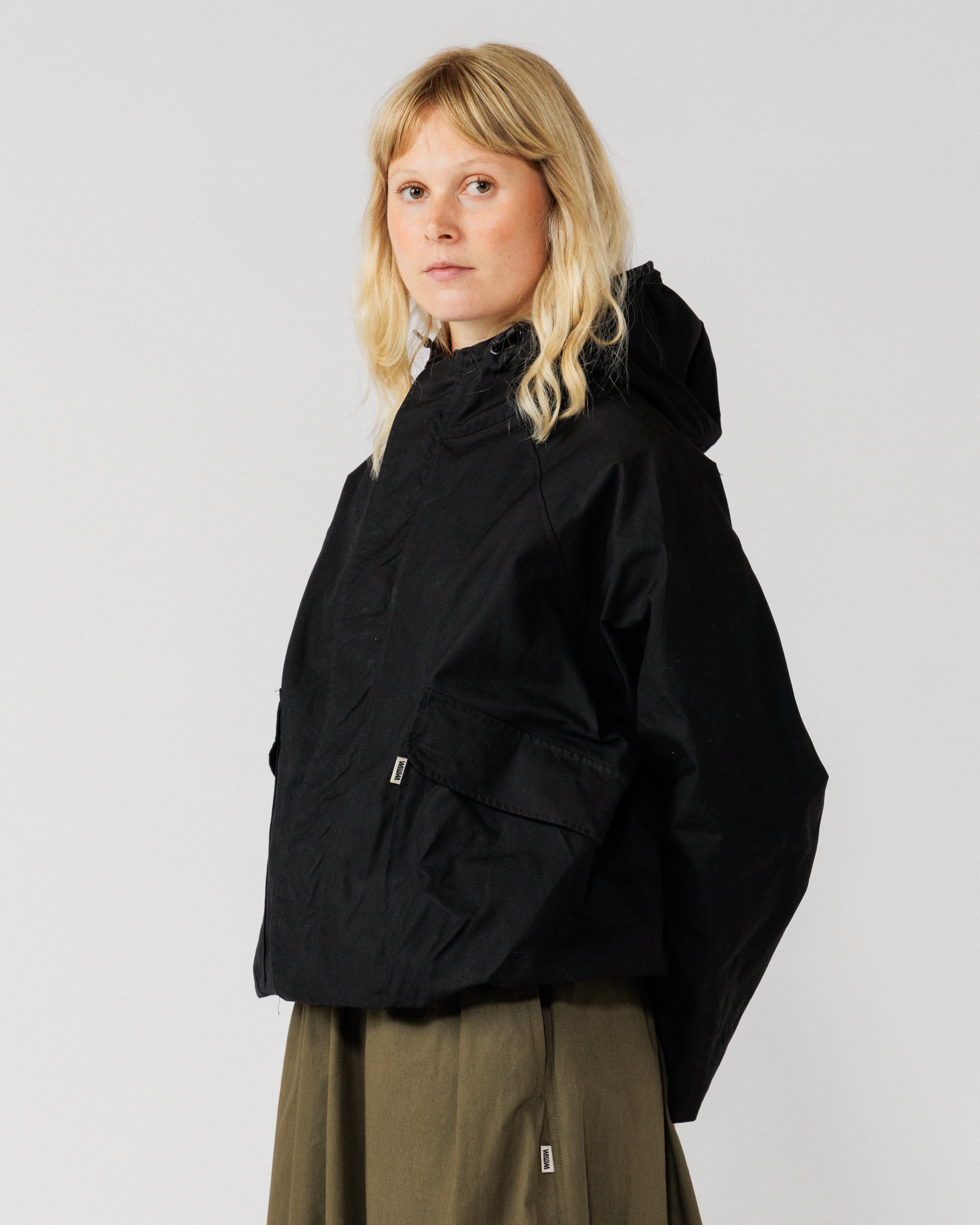 Roam Raglan Jacket - Black — female three-quarter angle, adds variety