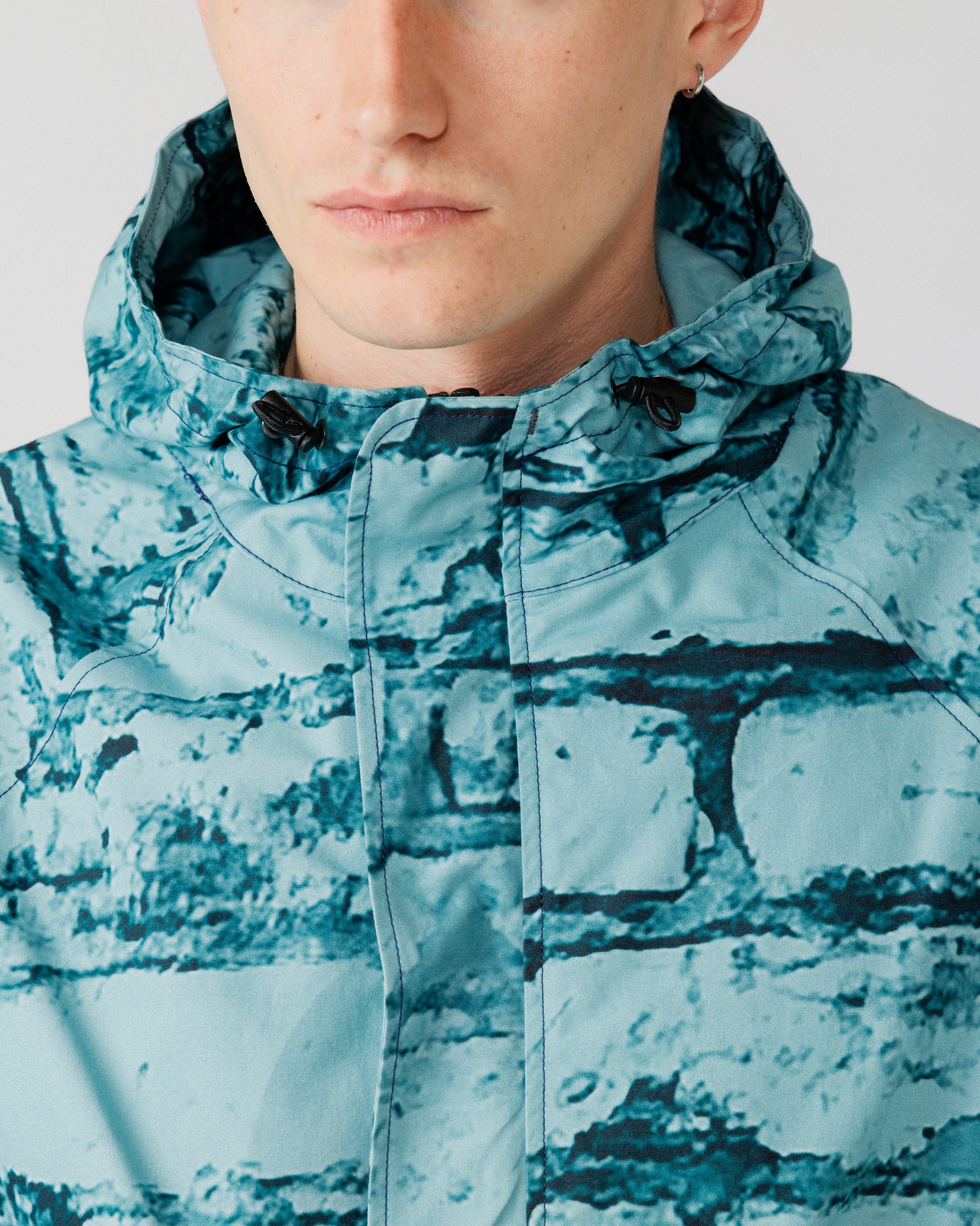 Roam Raglan Jacket - Blue Brick Camo — hood and collar toggles detail
