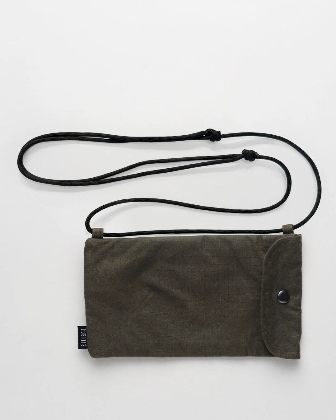 WAWWA x Cubitts Sunnies Sling in khaki with adjustable cord strap, front view